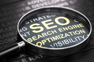 Magnifying glass on the word SEO